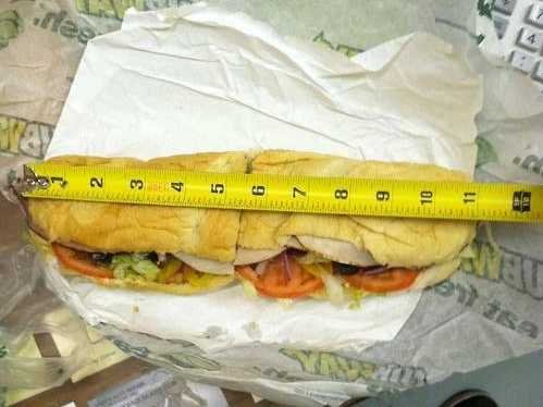 footlong sub sandwich next tape measure showing 11 inches